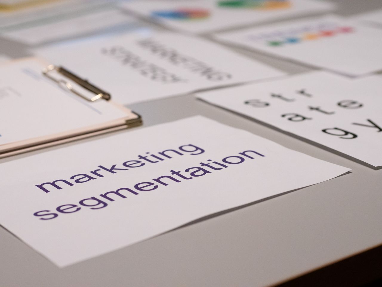 Close-up view of assorted marketing papers laid out on a desk, ideal for business and strategy conversations.